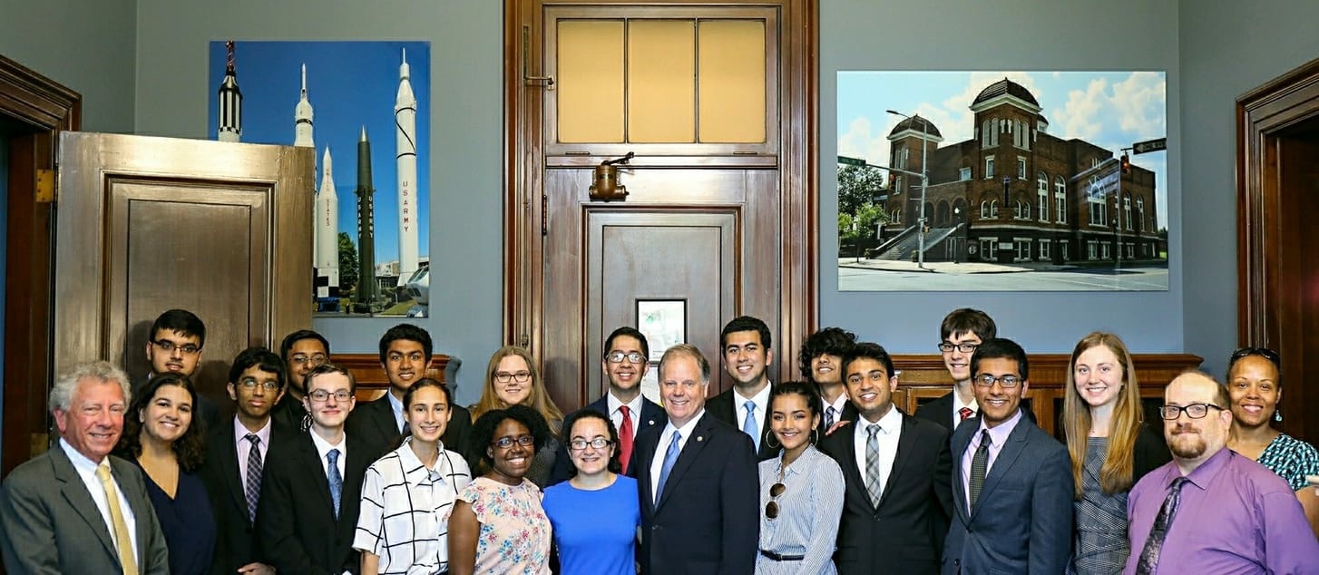 Students meet with Doug Jones prior to his introduction of the Cold Case Act into the Senate on July 10, 2018.